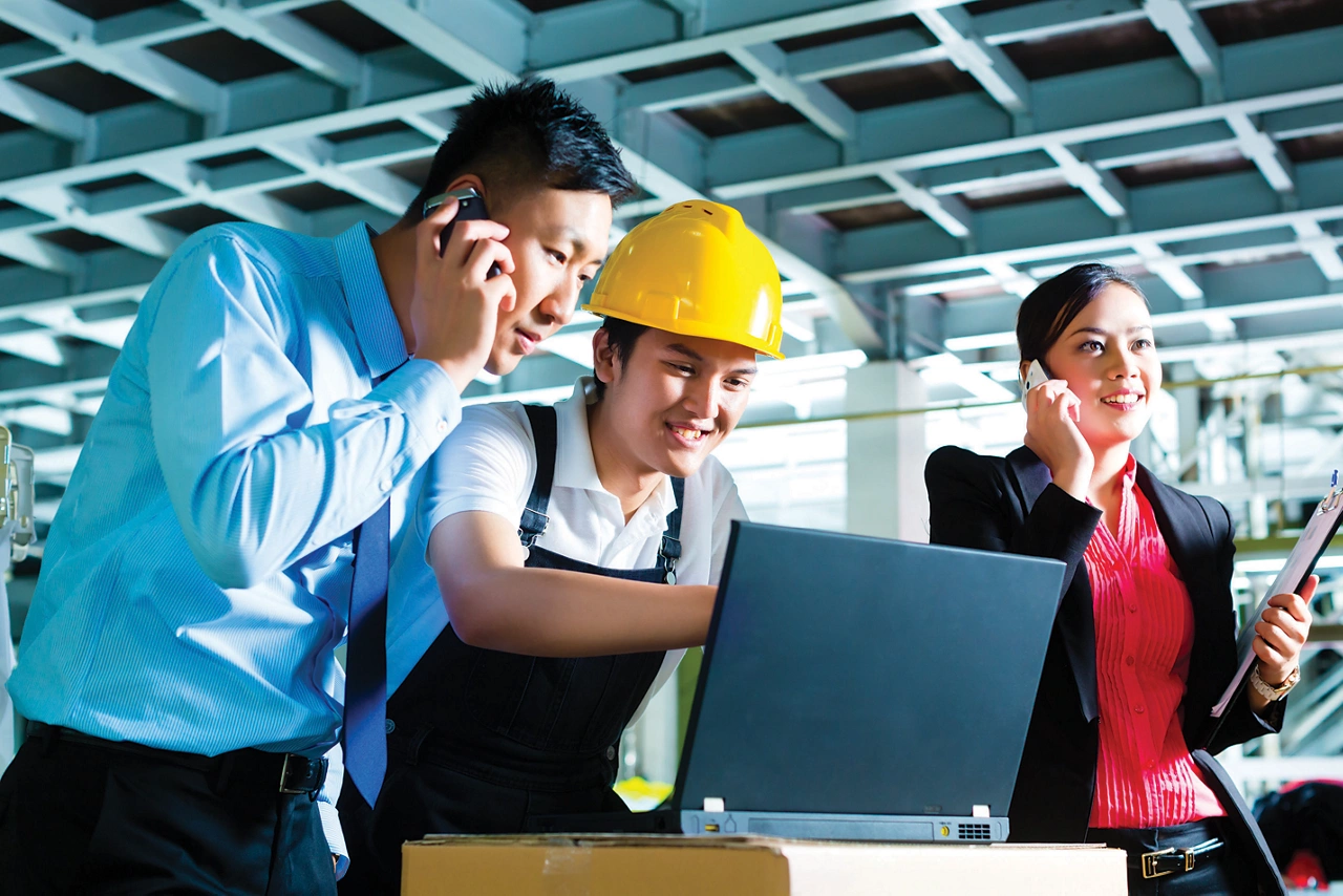 Worker or production manager and customer service, look on a laptop in a textile factory and help on the phone
